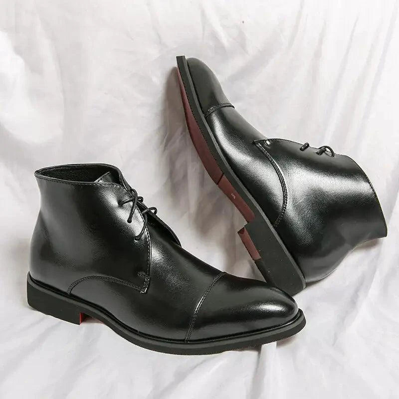 Mandotos red bottom leather boots with sleek design and pointed toes, shown from a side view.