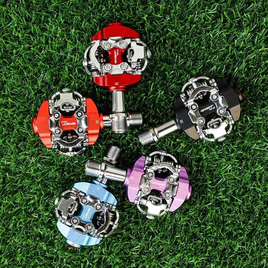 Mandotos RYET MTB clipless pedals with textured grip surface for secure mountain biking control and performance.