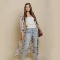 Mandotos Safari Chic Kimono featuring a lightweight, patterned fabric with wide sleeves and a relaxed fit.