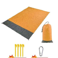 Mandotos sandproof portable beach mat spread on sand, lightweight and easy to carry for outdoor beach trips.