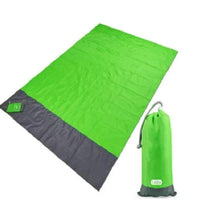 Mandotos sandproof portable beach mat spread out on sandy shore, lightweight and easy to carry for outdoor beach outings.