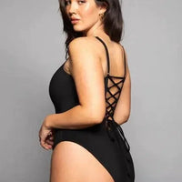 Mandotos Sculpting Beachwear Bodysuit displayed on a mannequin, featuring a sleek, form-fitting design ideal for beachwear and swim fashion.