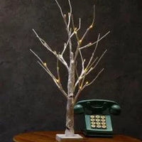 Mandotos Serenity Silver Birch LED Light with glowing white branches, ideal for cozy home decor or ambient lighting.