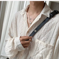 Mandotos apricot men's long-sleeved mesh shirt with lapel, hollow-out design, stylish fashion blouse for vacation or casual wear.