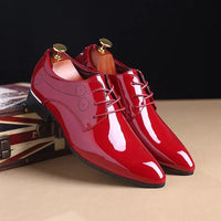 Mandotos sleek leather Oxford shoes with classic design, featuring smooth black leather and stylish lace-up closure.