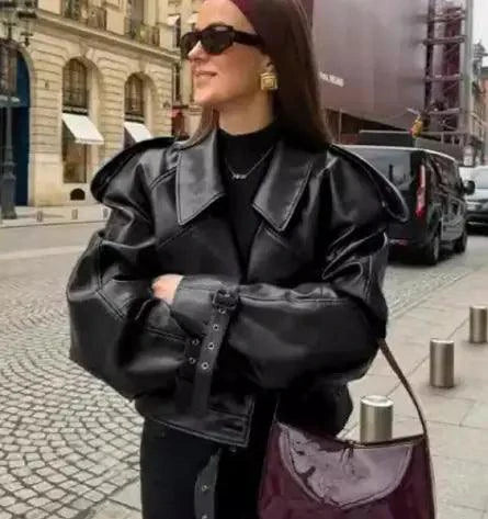Mandotos sleek matte leather coat with a stylish design, featuring smooth leather texture and modern silhouette.