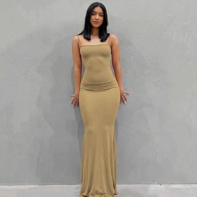 Mandotos sleek satin backless gown featuring smooth fabric and elegant design, perfect for formal occasions.