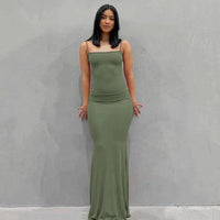 Mandotos sleek satin backless gown featuring a smooth, shiny fabric and elegant design perfect for formal occasions.
