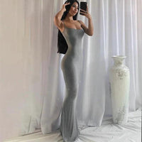 Mandotos sleek satin backless gown with a fitted silhouette, smooth fabric, and elegant design perfect for formal occasions.