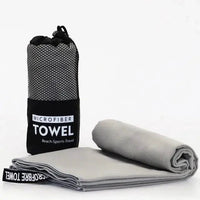 MANDOTOS Speedy Absorb Microfiber Towel shown folded with soft, quick-drying fabric for travel and outdoor activities.