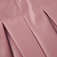 Mandotos Spice Faux Leather Pleated Mini skirt showcasing its textured pleats and rich faux leather material.