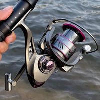 Mandotos SpinMaster Series 1000-7000 fishing reel with metal handle and spool, designed for freshwater and saltwater fishing.