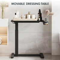 Mandotos standing scroll side table with hidden wheels, height-adjustable for beds or living spaces, featuring a stylish design.