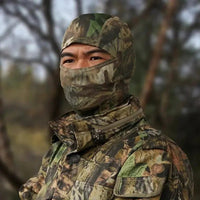 Mandotos Stealth Ops camo face mask with black and green camouflage pattern, made of breathable fabric for outdoor activities.