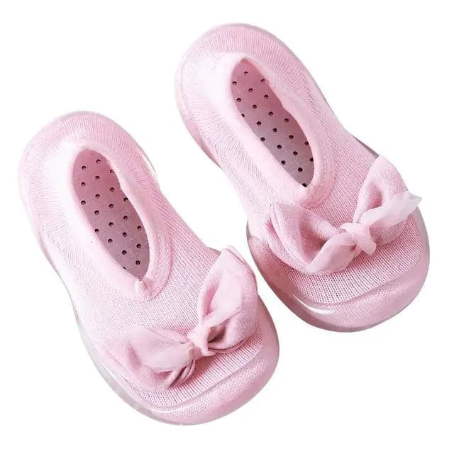Cute toddler shoes by MANDOTOS with soft fabric and velcro straps, designed for comfort and easy wear for young children.
