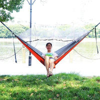 Mandotos Traveler's Mosquito-Free Hammock with breathable netting and durable fabric for outdoor relaxation.
