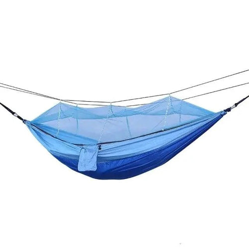 Mandotos Traveler's Mosquito-Free Hammock with mesh sides, hanging outdoors for comfortable, bug-free relaxation.