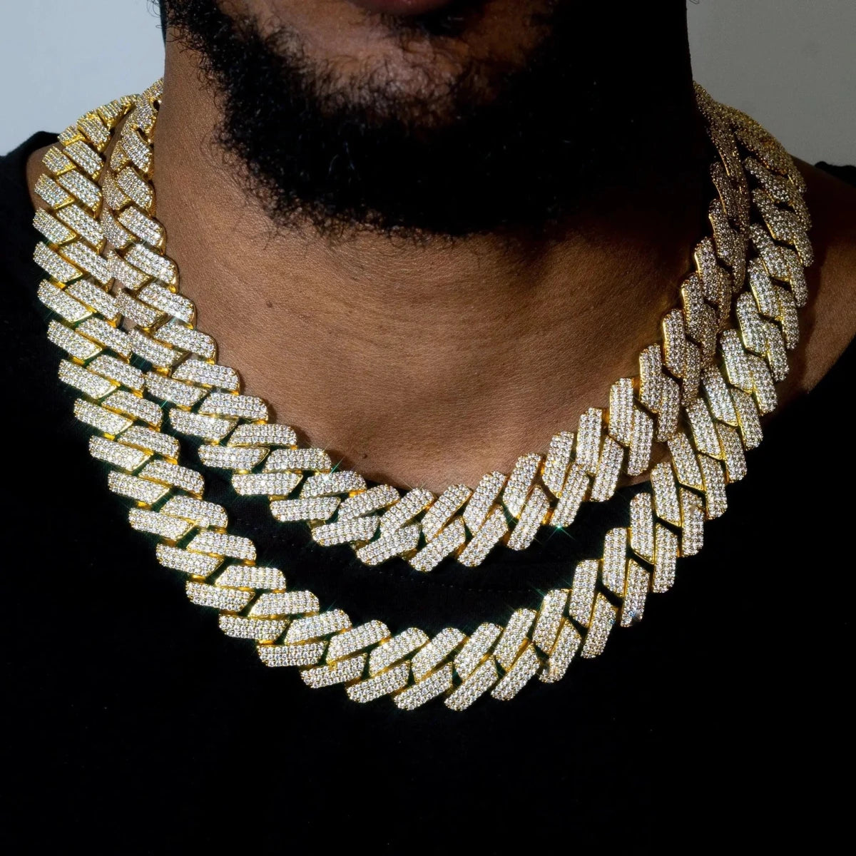 Mandotos triple row diamond gold Cuban chain featuring sparkling diamonds and a bold, luxurious gold link design.