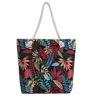 Twin-sided artistic canvas bag by MANDOTOS with colorful abstract designs, sturdy handles, and spacious interior for everyday use.