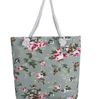 Twin-sided artistic canvas bag by MANDOTOS with colorful abstract designs on each side, sturdy handles, and versatile style.