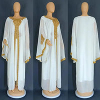 Mandotos two-piece gold kaftan abaya dress set with flowing fabric and elegant design, ideal for stylish occasions.