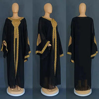 Mandotos two-piece gold kaftan abaya dress set featuring elegant flowing fabric and intricate detailing for a stylish look.