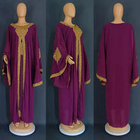 Mandotos two-piece gold kaftan abaya dress featuring elegant flowing fabric and intricate design details.