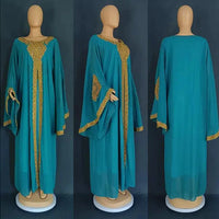 Mandotos two-piece gold kaftan abaya dress set featuring elegant flowing fabric and intricate design details.