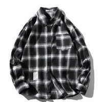 Unisex checkered long sleeve shirt by MANDOTOS featuring a classic pattern and button-up front, modeled on a white background.