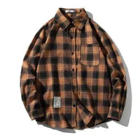 Unisex checkered long sleeve shirt by MANDOTOS featuring a classic black and white plaid pattern and button front design.