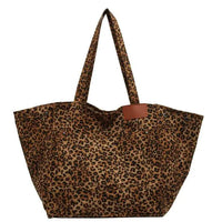 Urban Leopard Canvas Tote by MANDOTOS featuring a stylish leopard print design on durable canvas fabric.