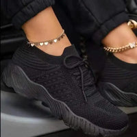 Mandotos walking shoes in black and gray with breathable mesh upper and cushioned sole for comfortable everyday wear.