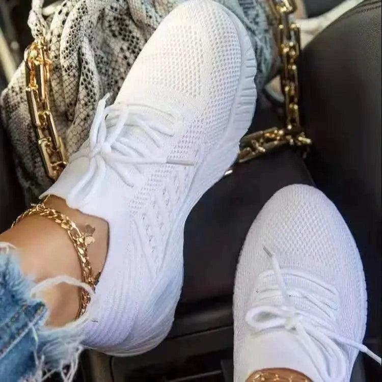 Mandotos walking shoes in black with white soles, featuring breathable mesh upper and cushioned insoles for comfortable walking.
