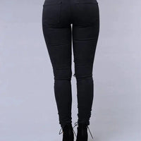 Mandotos women's high waist skinny ripped washed denim jeans, casual Y2K style with distressed holes and stretch fit.