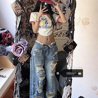 Plus size ripped denim women's pants by MANDOTOS with high waist and wide-leg, perfect for summer retro street style.