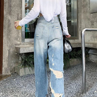 Plus size American Hole high waist straight-leg denim pants for women by MANDOTOS, showcasing the trendy distressed denim style.