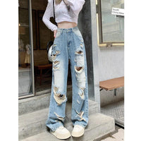 Plus size American Hole high waist straight-leg denim pants for women by MANDOTOS, showing the stylish fit and distressed details.