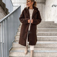 Women's lamb wool coat by MANDOTOS, featuring a stylish and warm outer layer with a tailored fit and soft wool texture.