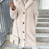 Women's wool coat by MANDOTOS featuring a cozy lamb wool design, perfect for stylish winter wear.