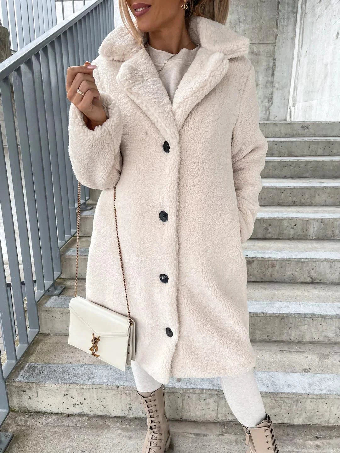 Women's lamb wool coat by MANDOTOS, shown in a stylish, warm outerwear design perfect for cold weather.