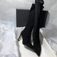 Women's high heel stretch below-the-knee boots by MANDOTOS showing sleek design and tall heel on smooth black material.