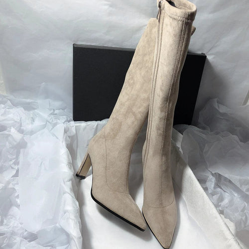 Mandotos women's high heel stretch below-the-knee boots showing sleek design and pointed toe on a neutral background.