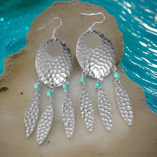 Turquoise accent Navette dream catcher earrings with feathers by The Urban Charm, showcasing intricate metalwork and boho style.